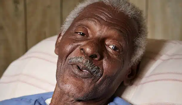 Smiling elderly man in a care setting