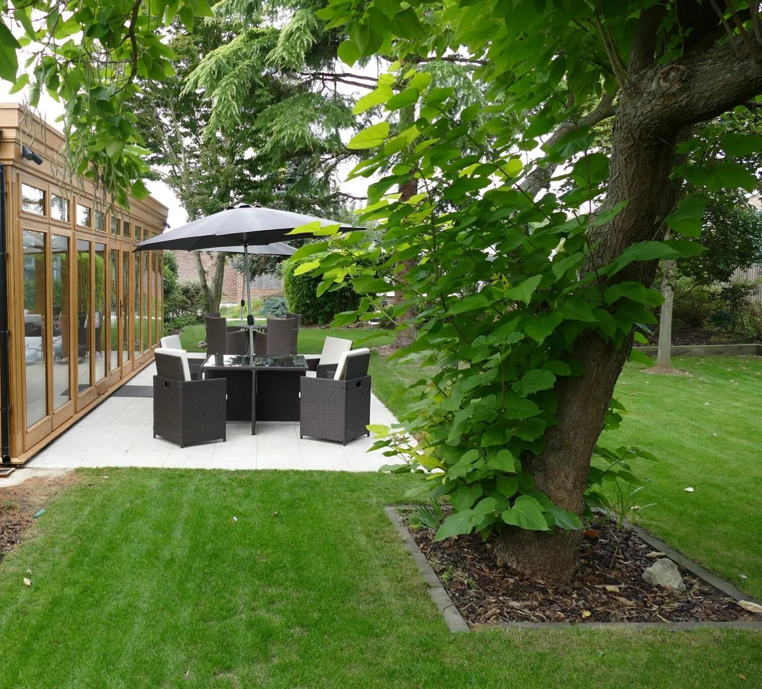 Outdoor patio with seating area and umbrella