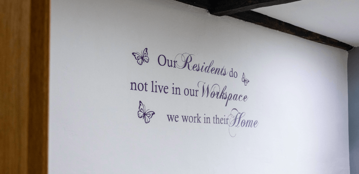 Inspirational quote on a wall in a facility interior.