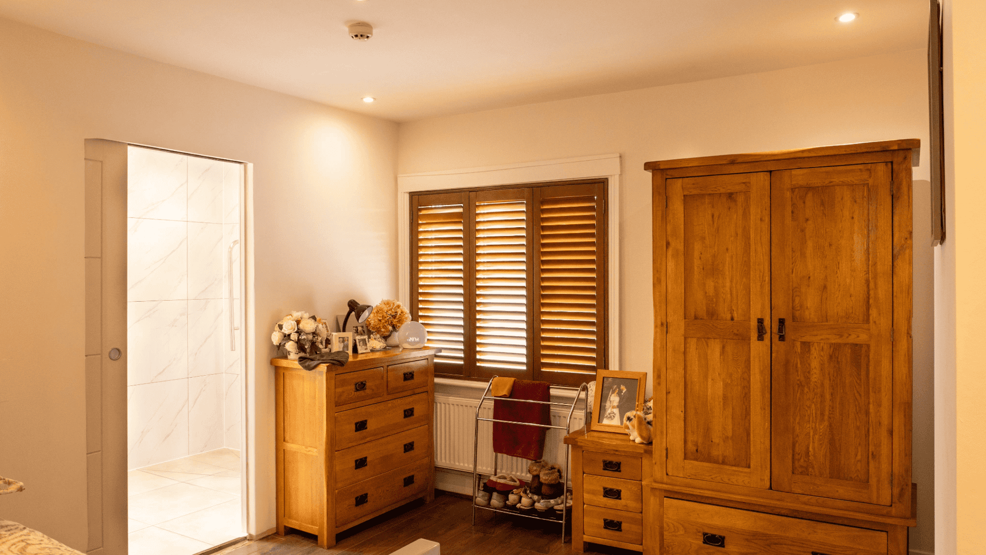 Cozy resident room with wooden furniture.