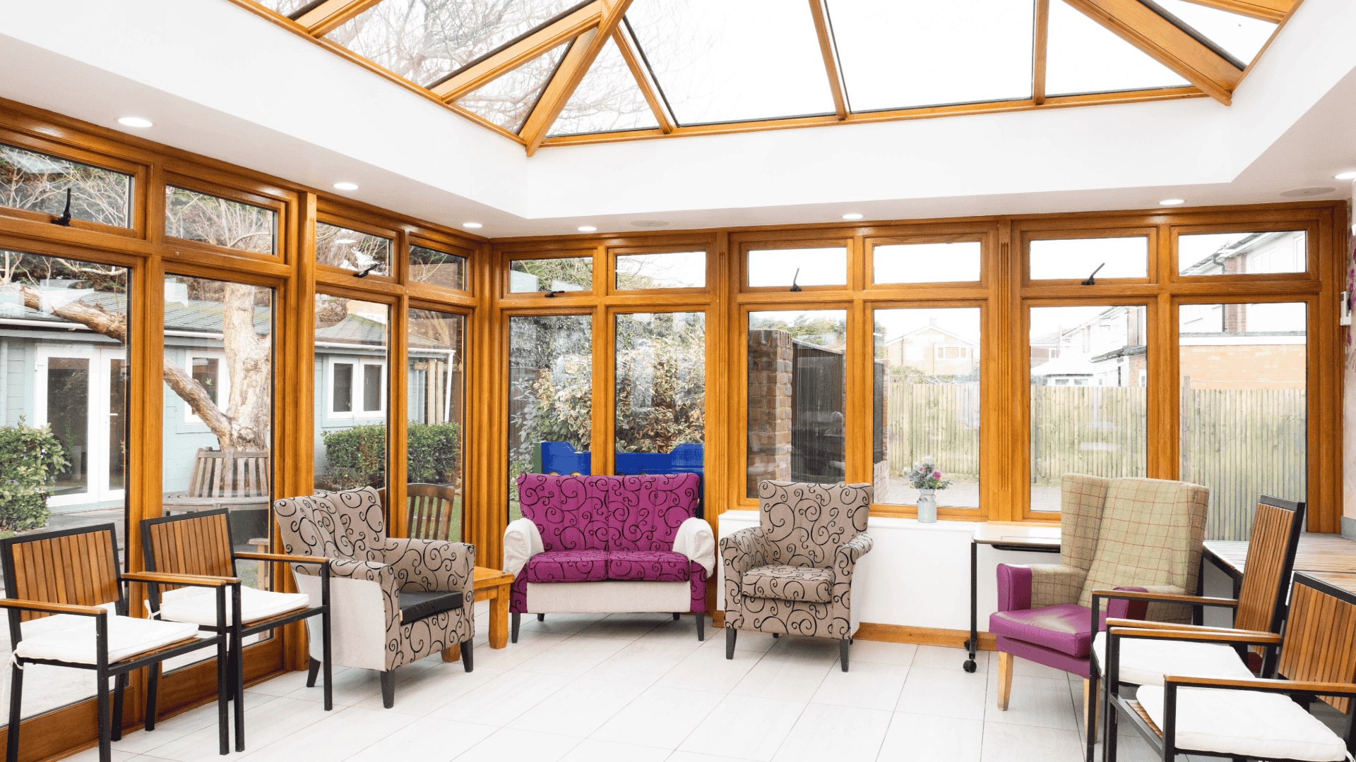 Bright common area with glass roof and seating.