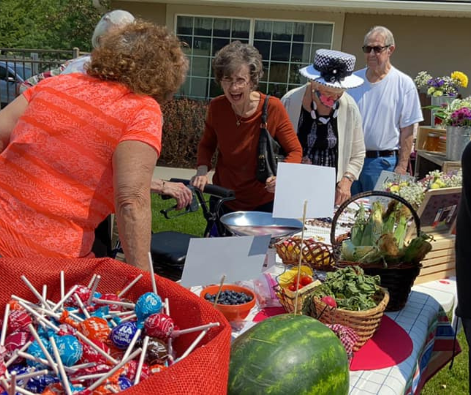 Residents engaging in outdoor gathering with food