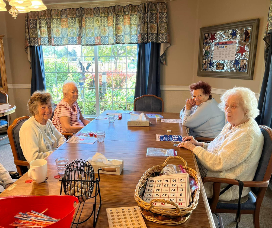 Seniors enjoying a game of bingo in a common area.