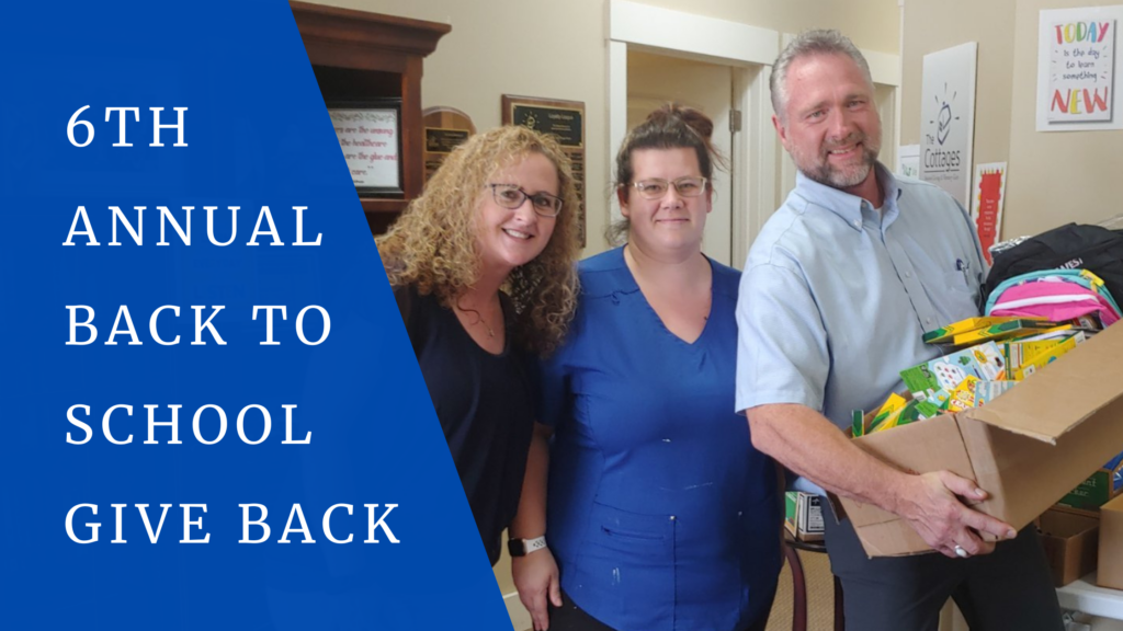 Staff and residents participating in a school supplies donation event.