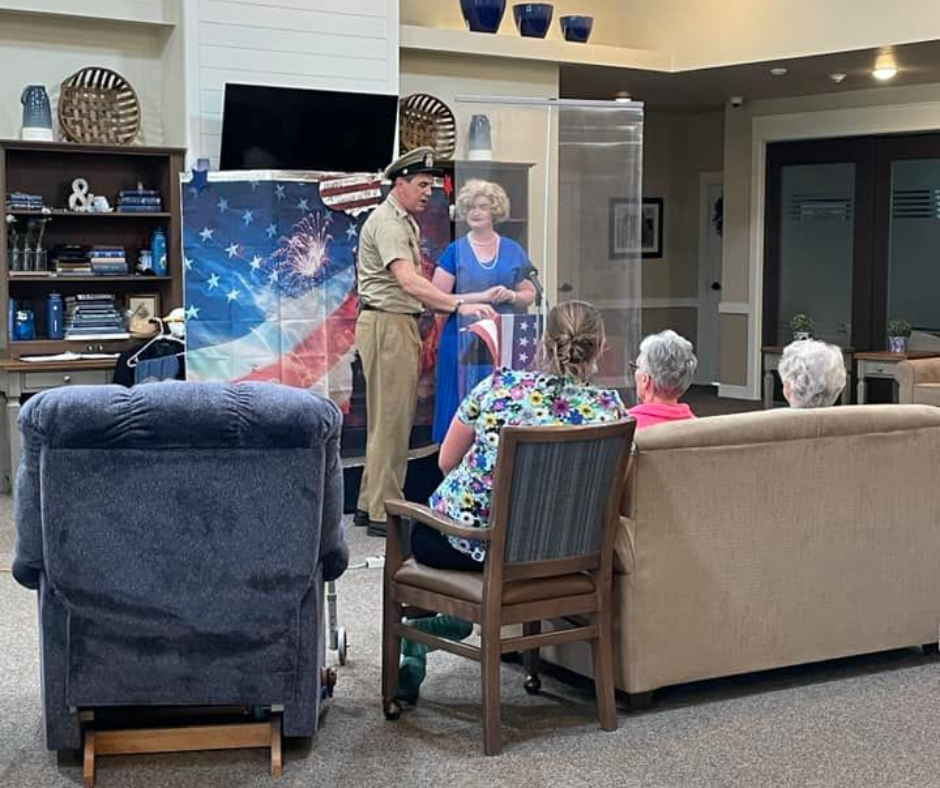 Residents enjoying a performance in a common area.