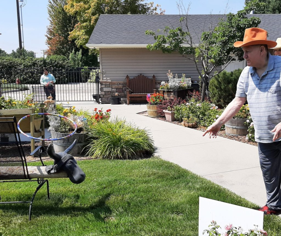 Residents engaging in outdoor activities with flowers.
