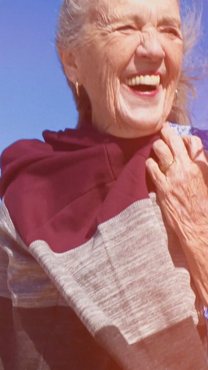 Resident smiling outdoors in casual clothing