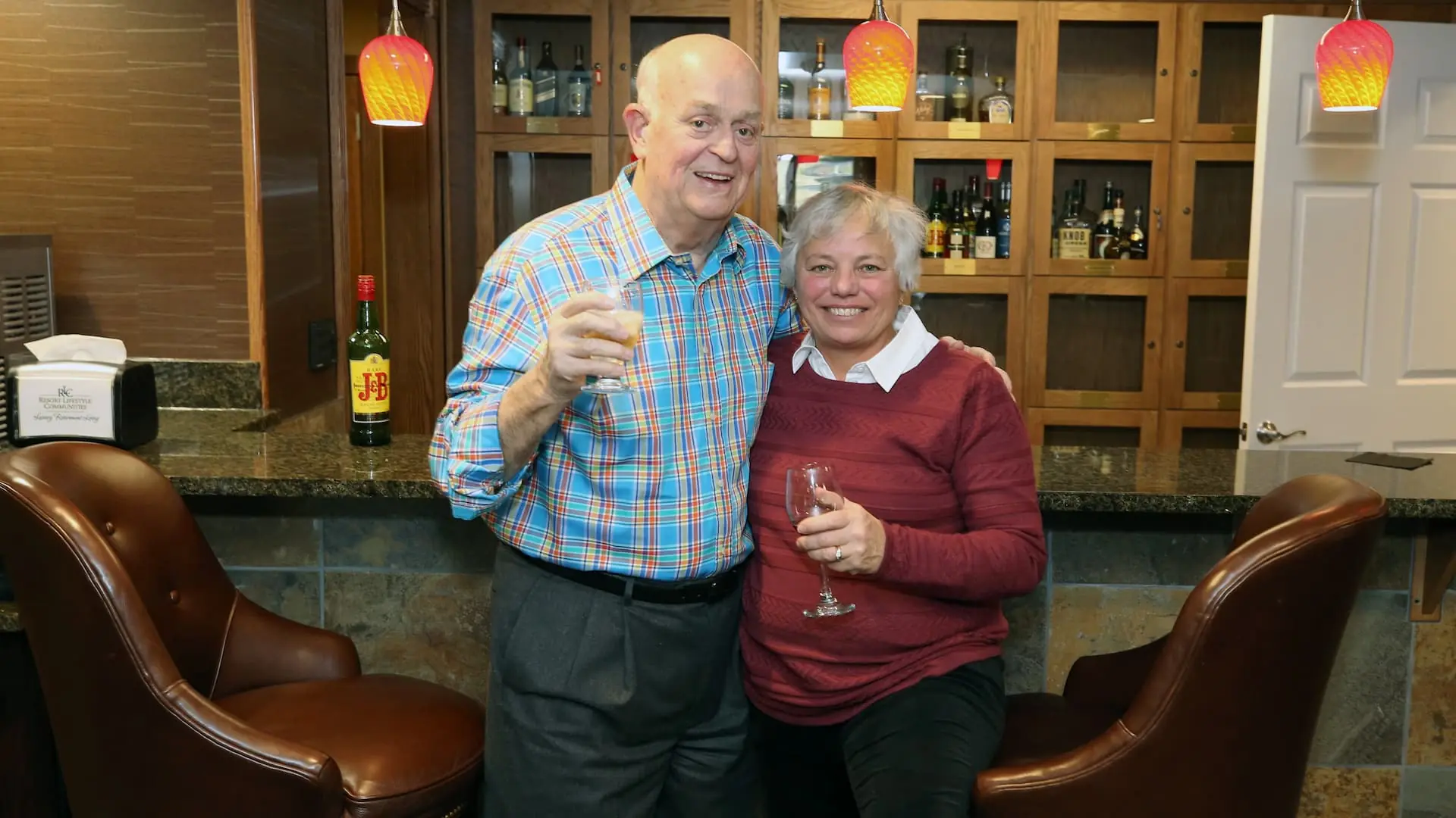 Two residents enjoying drinks at the bar