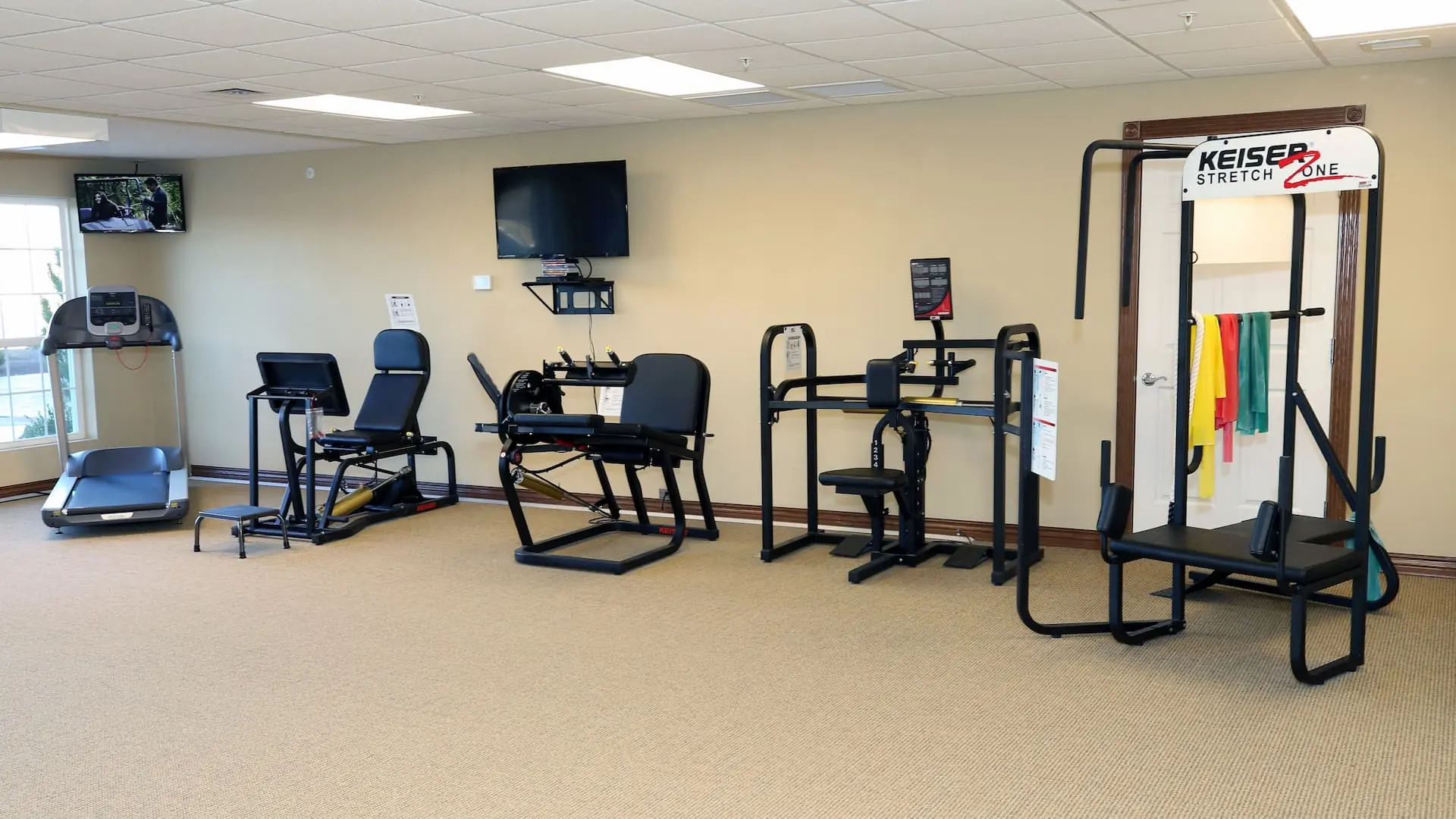 Fitness equipment in a well-lit exercise room