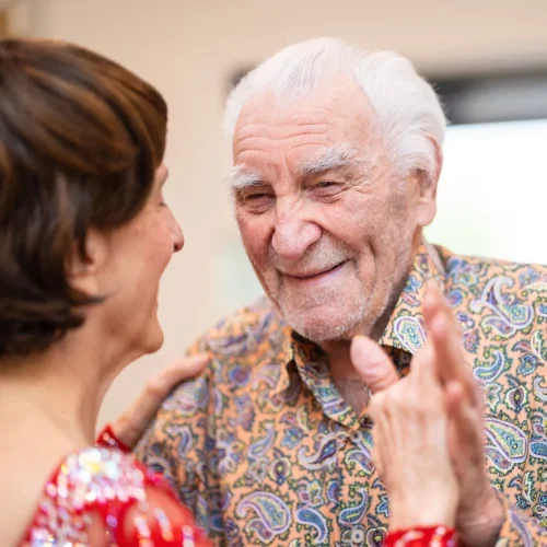 Residents enjoying a dance together in a communal space