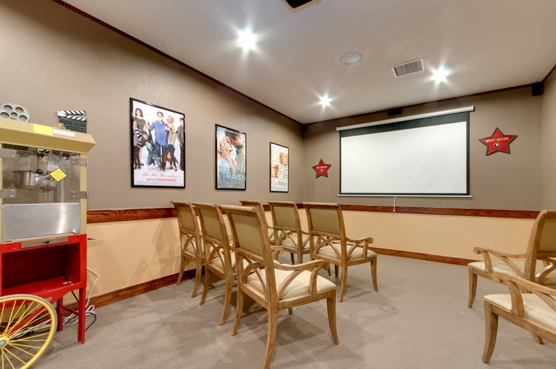 Cozy activity room with seating and movie posters