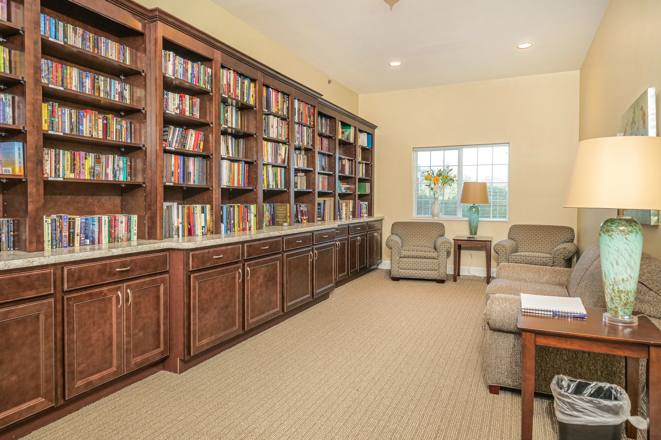 Comfortable library area with bookshelves and seating