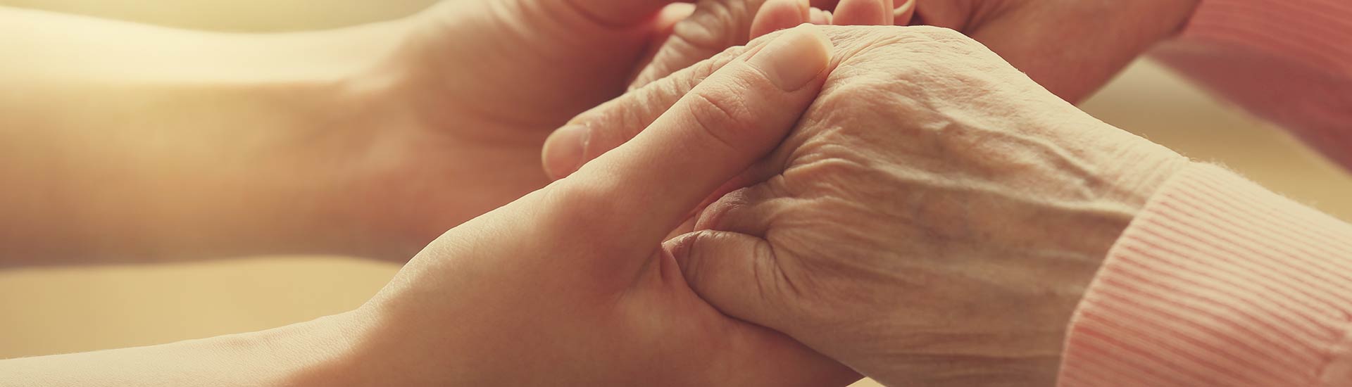 Close-up of hands holding each other