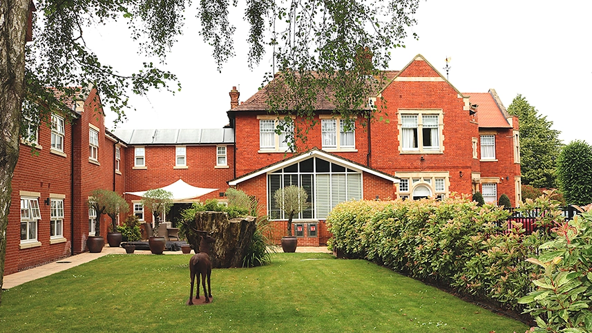 Exterior view of Lyncroft Care Home and garden.