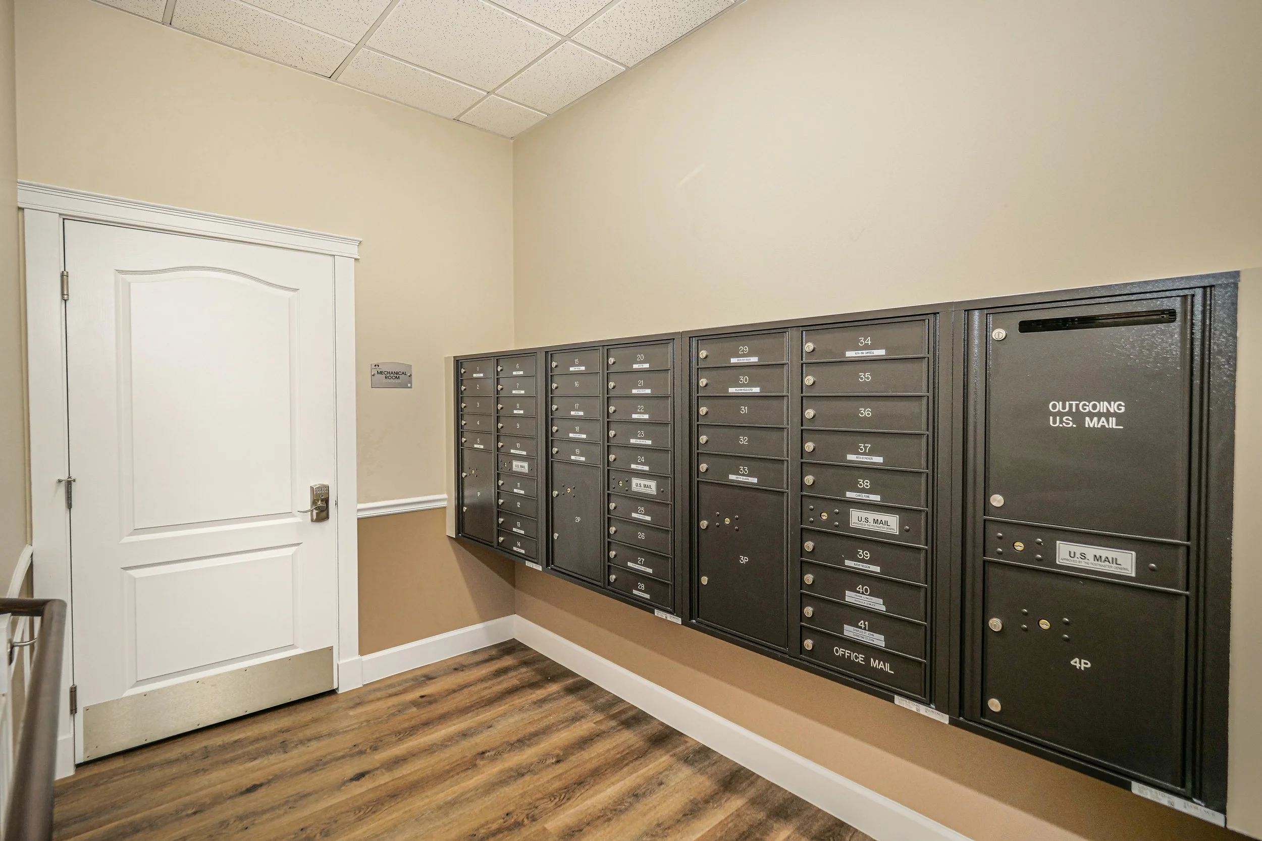 Interior view of a mail area with mailboxes.