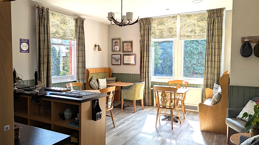 Cozy common area with tables and windows