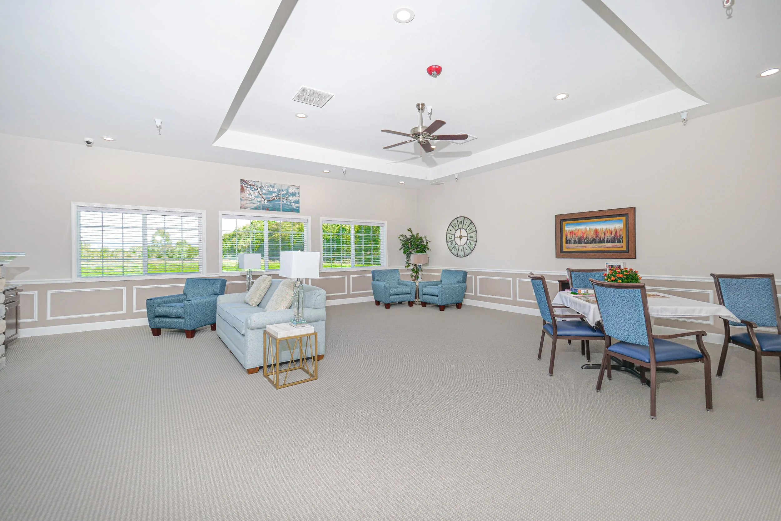 Well-lit common area with seating and dining space.