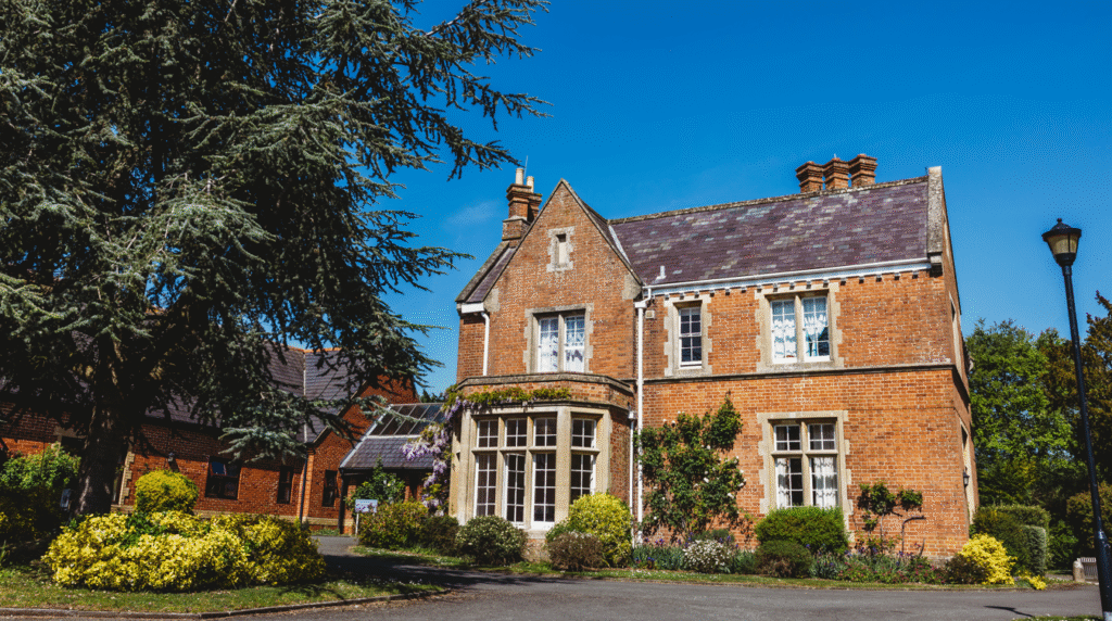 Charming red brick building with garden