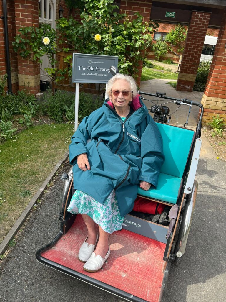 Resident in a wheelchair outside The Old Vicarage