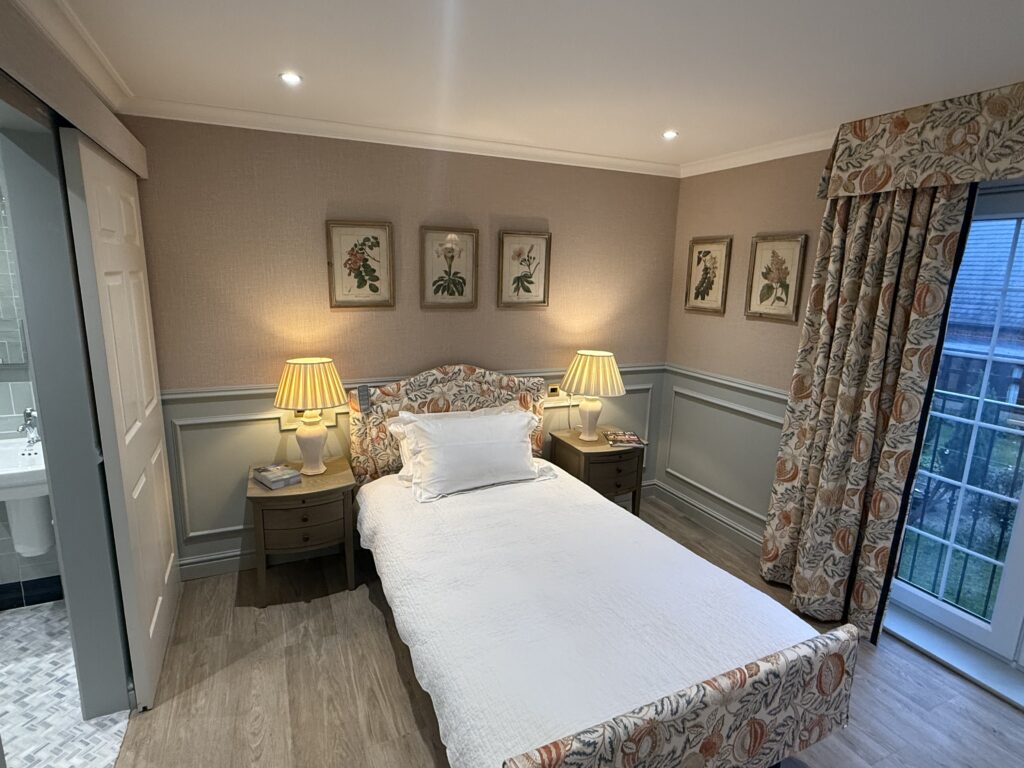 Cozy bedroom with floral accents and lamps
