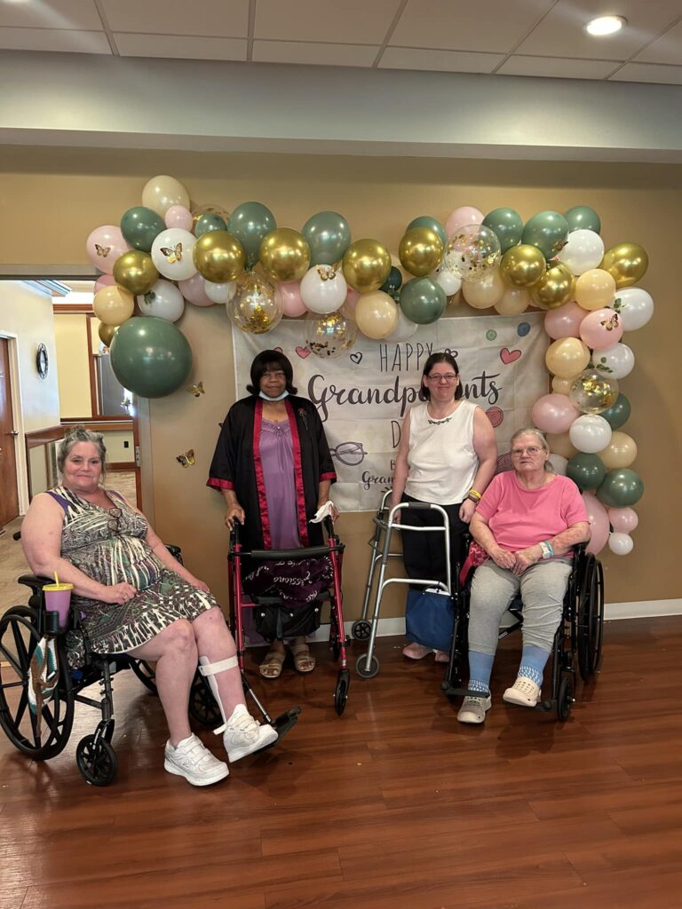 Residents celebrating Grandparents Day with balloons and decorations