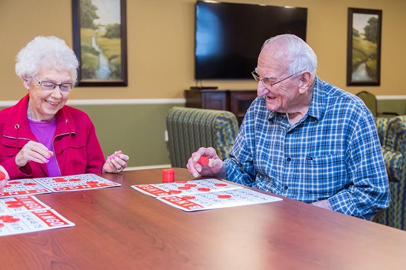 Residents enjoying a game of bingo in a common area