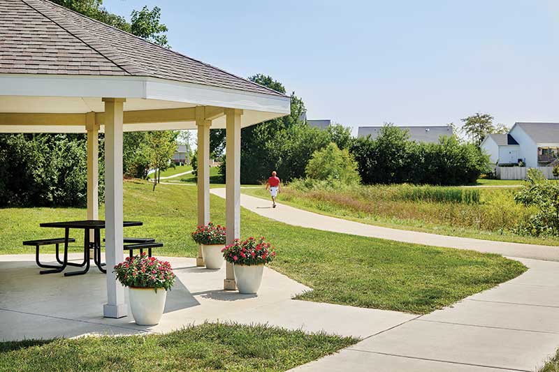 Pathway leading to gazebo in a landscaped area