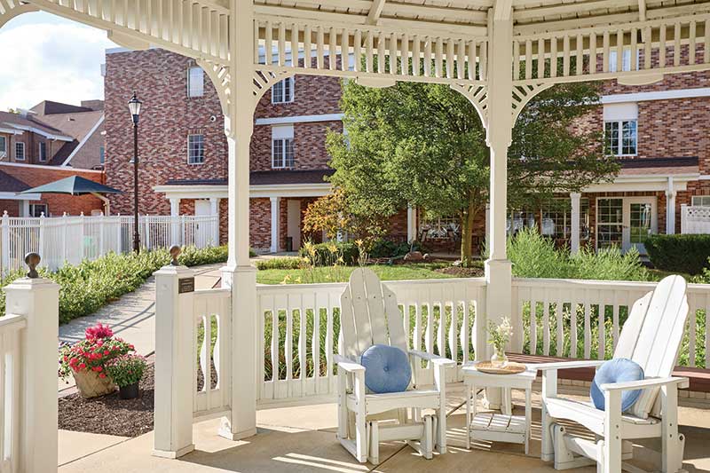 Outdoor seating area with gazebo and gardens