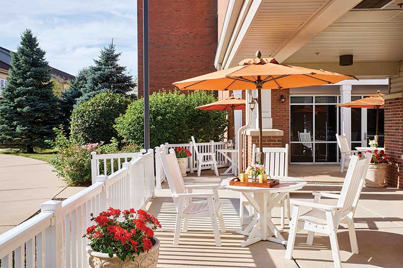 Outdoor patio area with seating and umbrellas