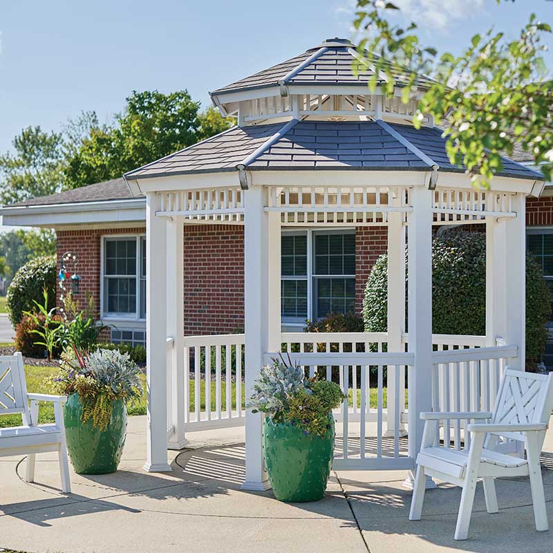 Outdoor gazebo with seating and plants