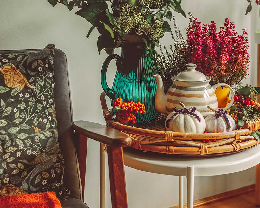 A cozy seating area with decorative fall-themed items