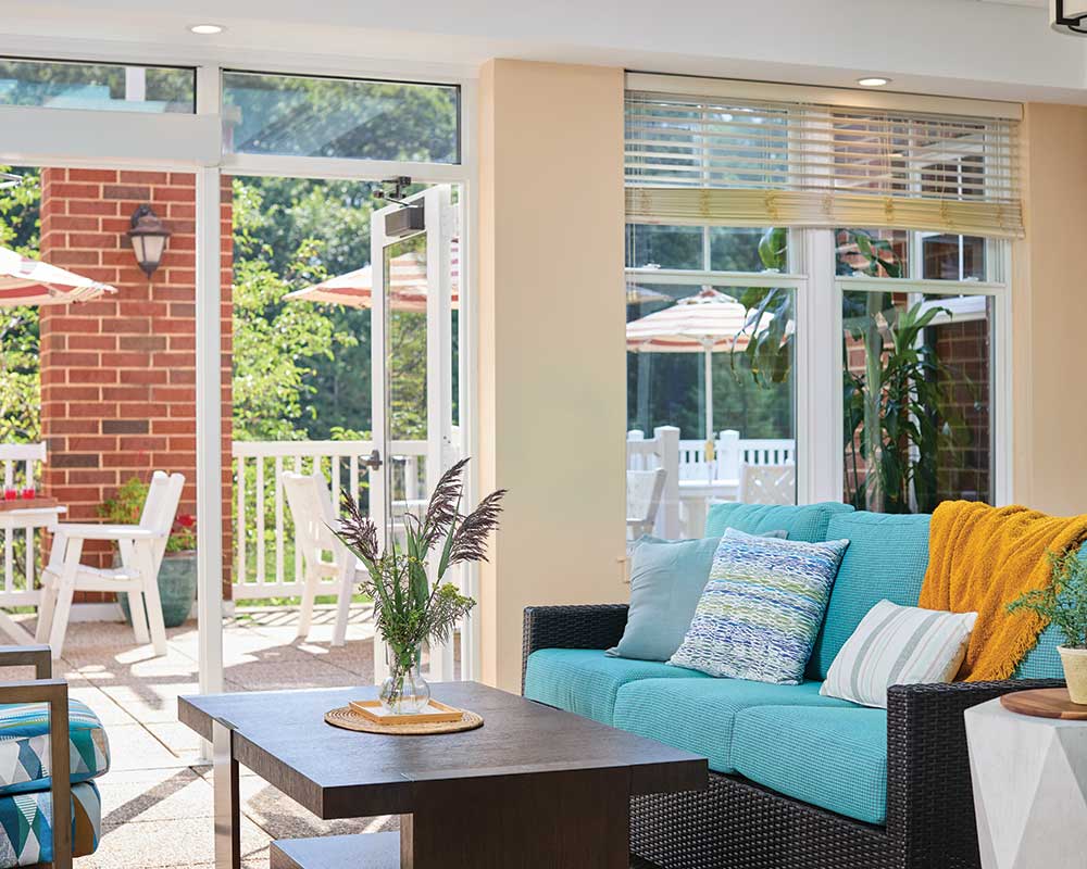 Bright common area with a view of outdoor seating
