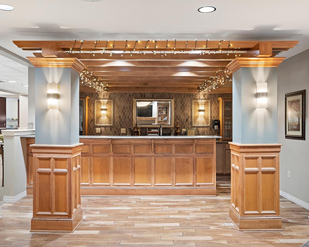 Common area with a wooden bar and decorative lighting