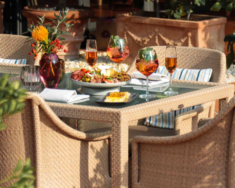 Elegant outdoor dining setup with food and drinks