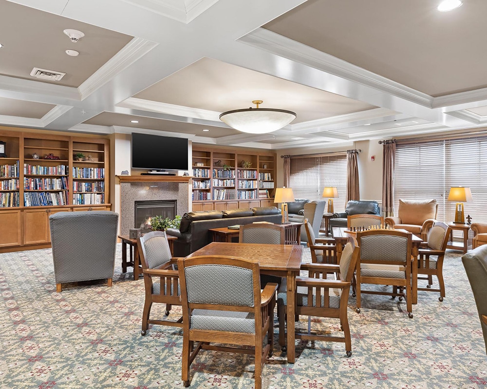 Bright common area with seating and bookshelves