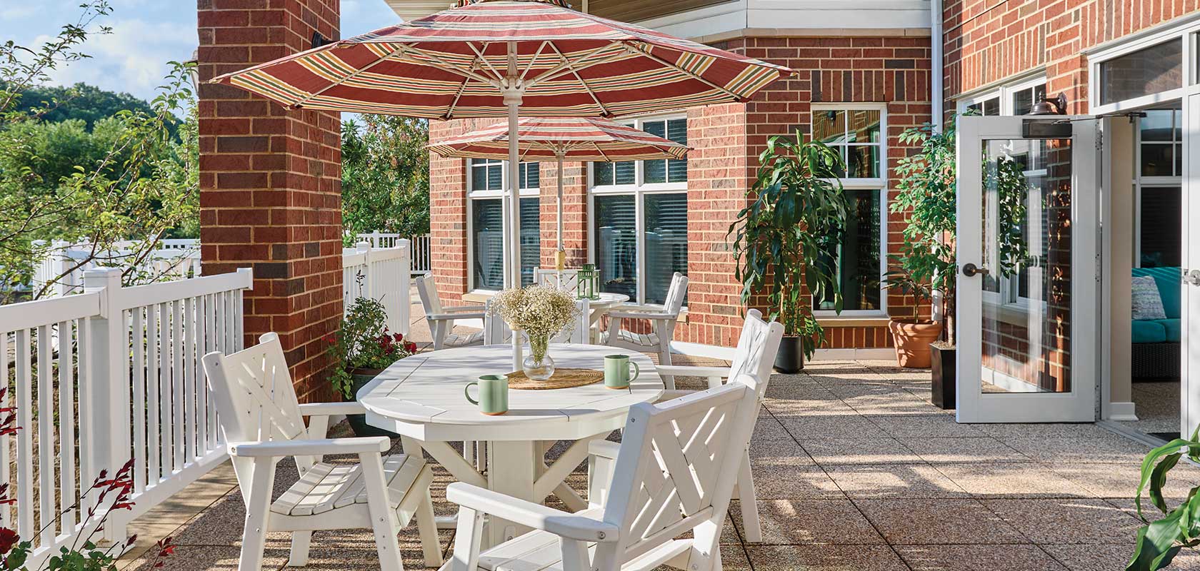 Outdoor patio area with seating and umbrellas