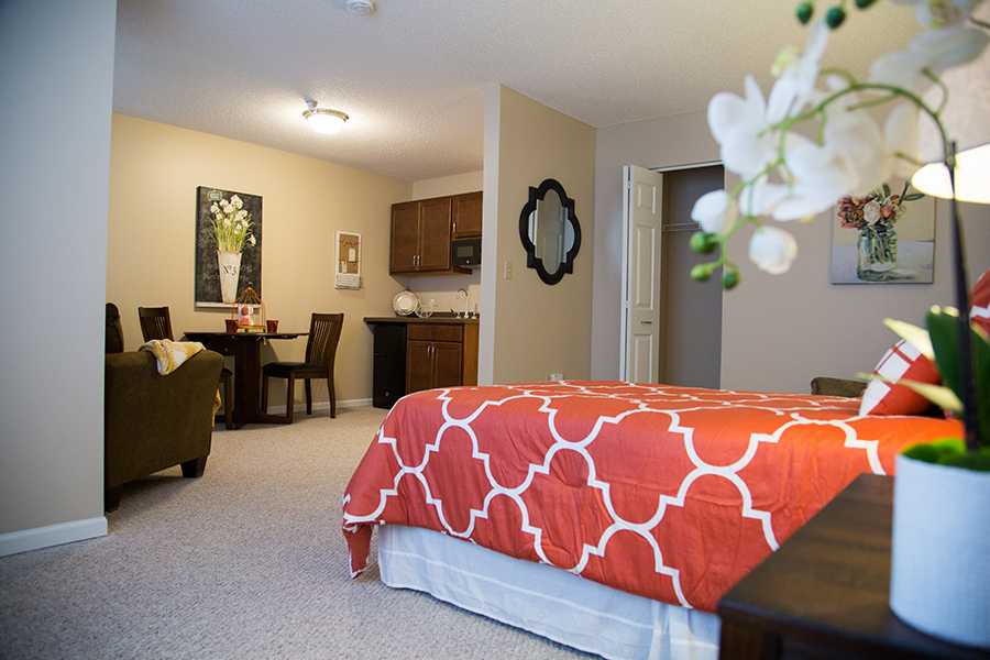 Cozy resident room with living area and kitchenette