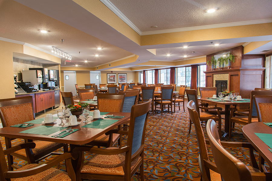 Bright dining room with elegantly set tables
