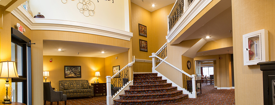 Interior view of a welcoming common area with stairs
