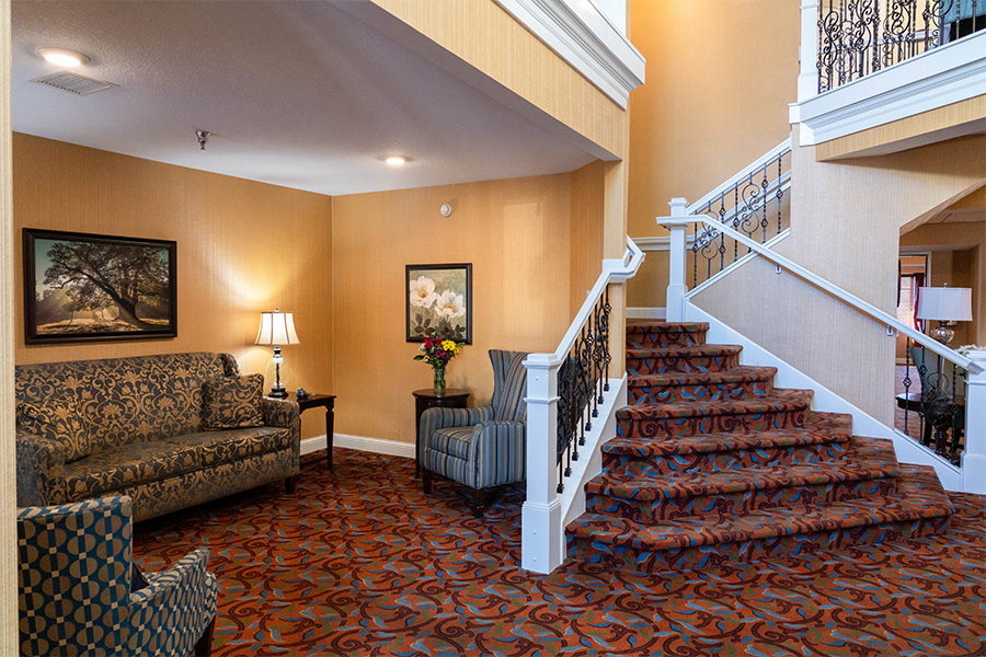Common area with a cozy seating arrangement and staircase