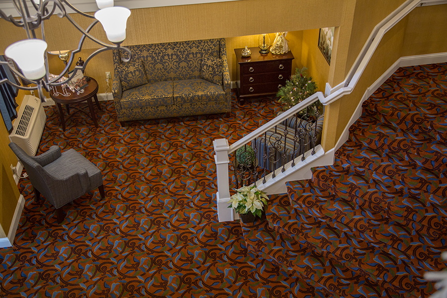 Interior view of a cozy common area with stairs