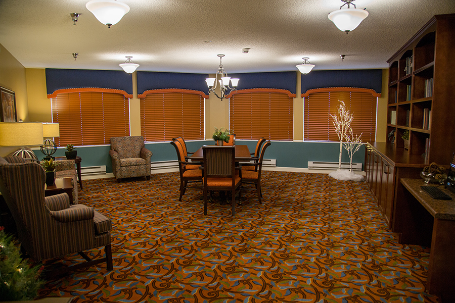 Bright common area with seating and a dining table