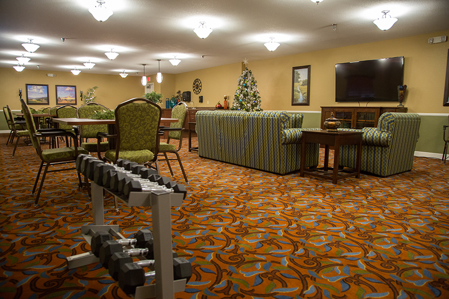 Cozy common area with seating and exercise equipment