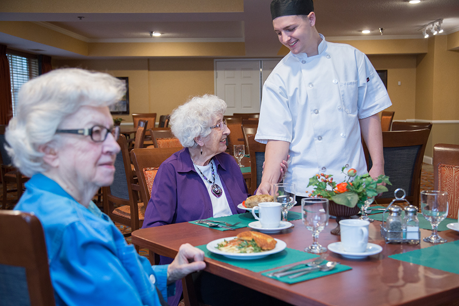 Residents enjoying a meal in the dining area