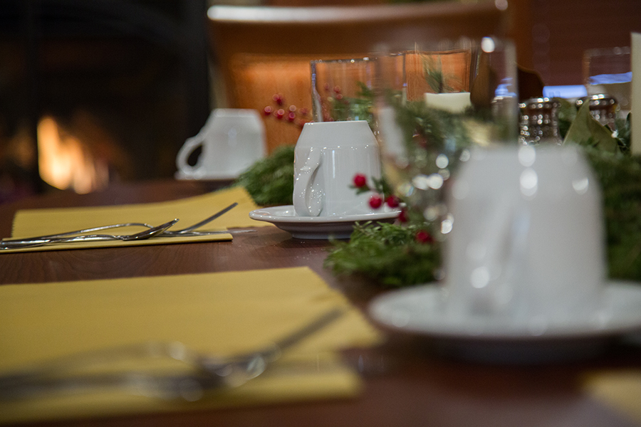 Dining table set with festive decorations and tableware