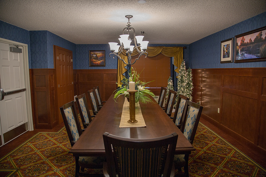 Well-decorated dining room with a large table and festive decor