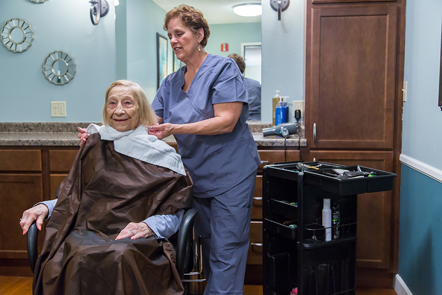 Resident getting a haircut in a salon