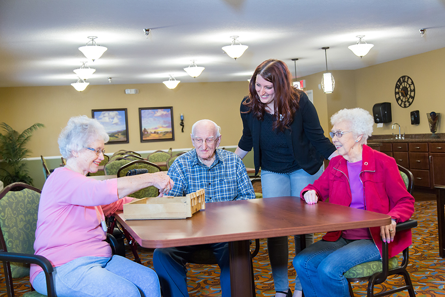 Residents and staff engaging in a social activity