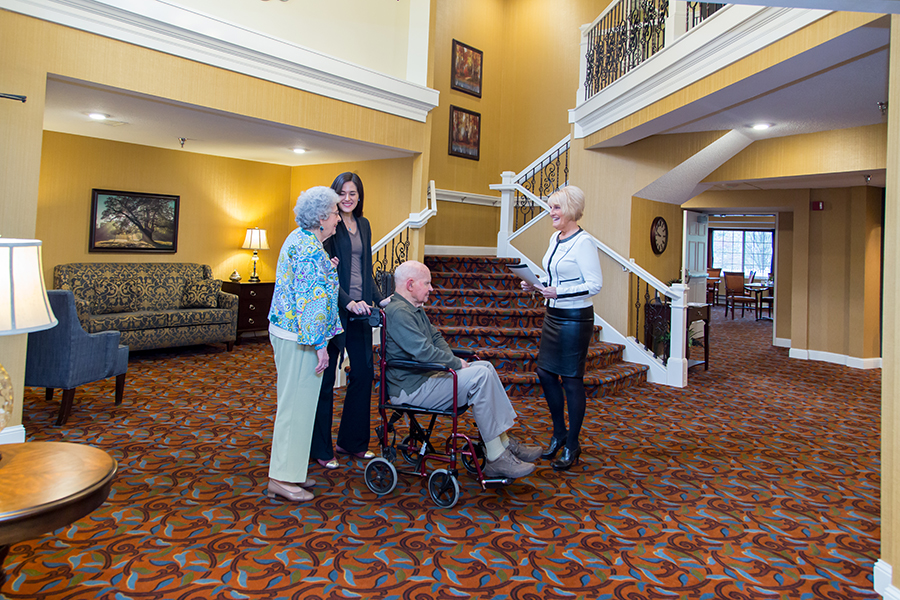 Residents and staff interacting in a welcoming lobby