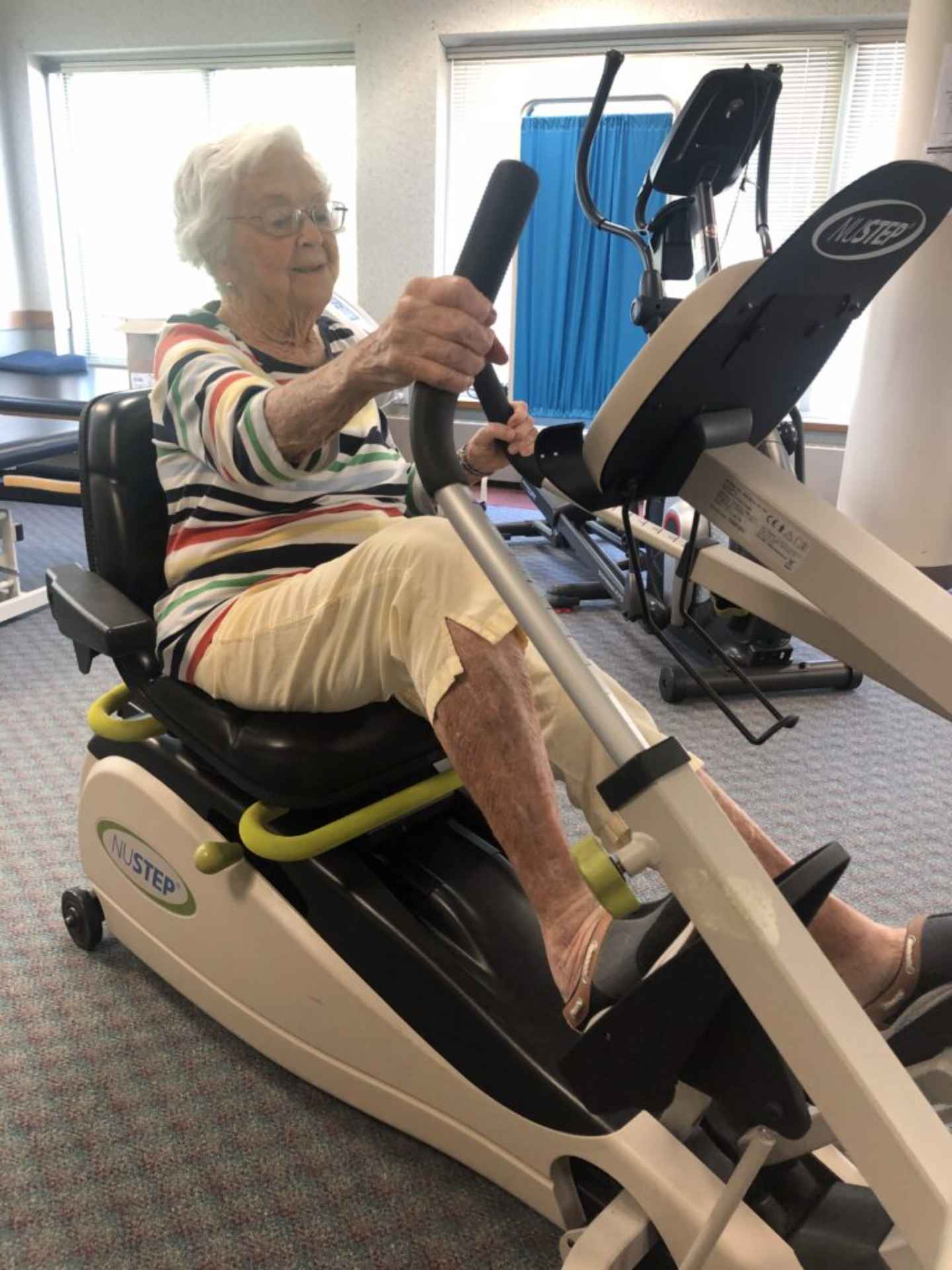 Senior exercising on a fitness machine